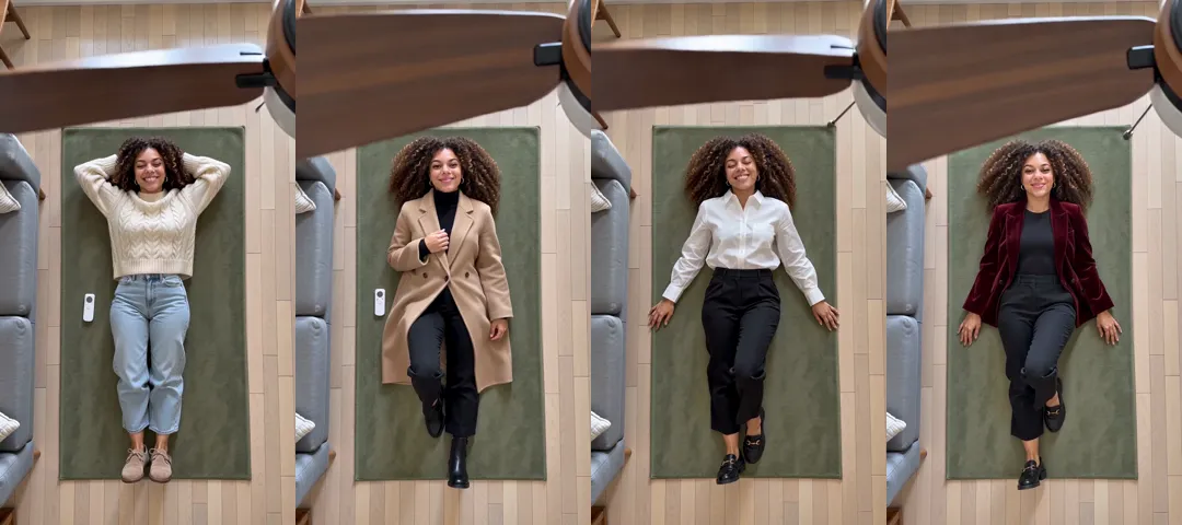 Four frames from one ceiling fan outfit change video, shot from above: a woman lying on a green rug in a cream sweater and jeans, then a camel coat, then a white shirt and black trousers, then a red velvet blazer